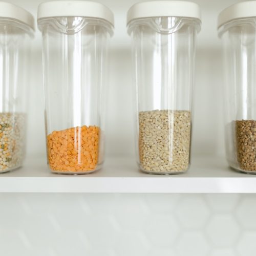 photo of a pantry filled with clear plastic containers. Amazon organization must haves