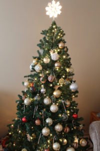 Decorated Christmas tree. Christmas decorations for small spaces. 