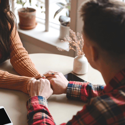 couple holding hands, reconnecting with spouse feature image