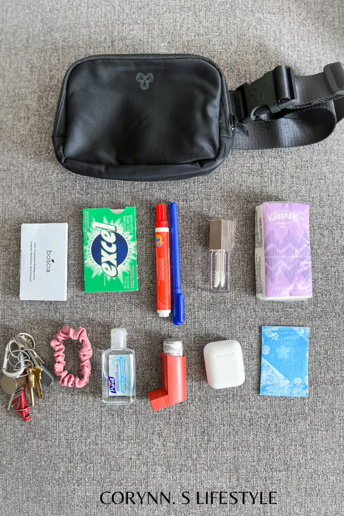 Photo of miscellaneous items and a belt bag. what I have inside my everywhere belt bag. 